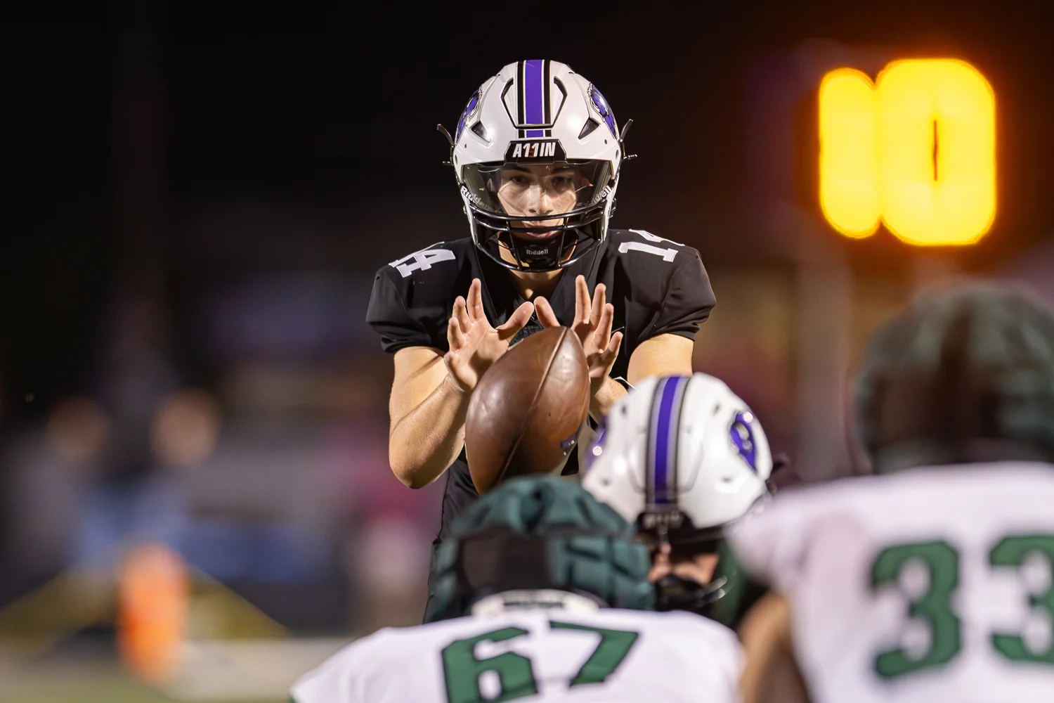 Buffalo Bison QB getting the snap of the football