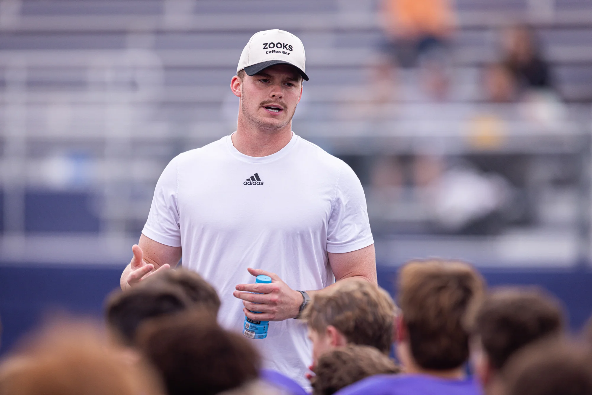 Buffalo Alum Treyton Welch speaking to the teams