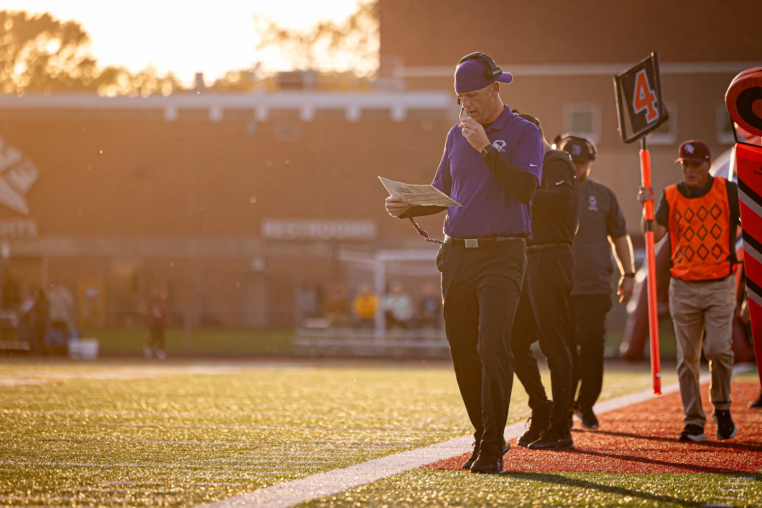 Coach checking his call sheet